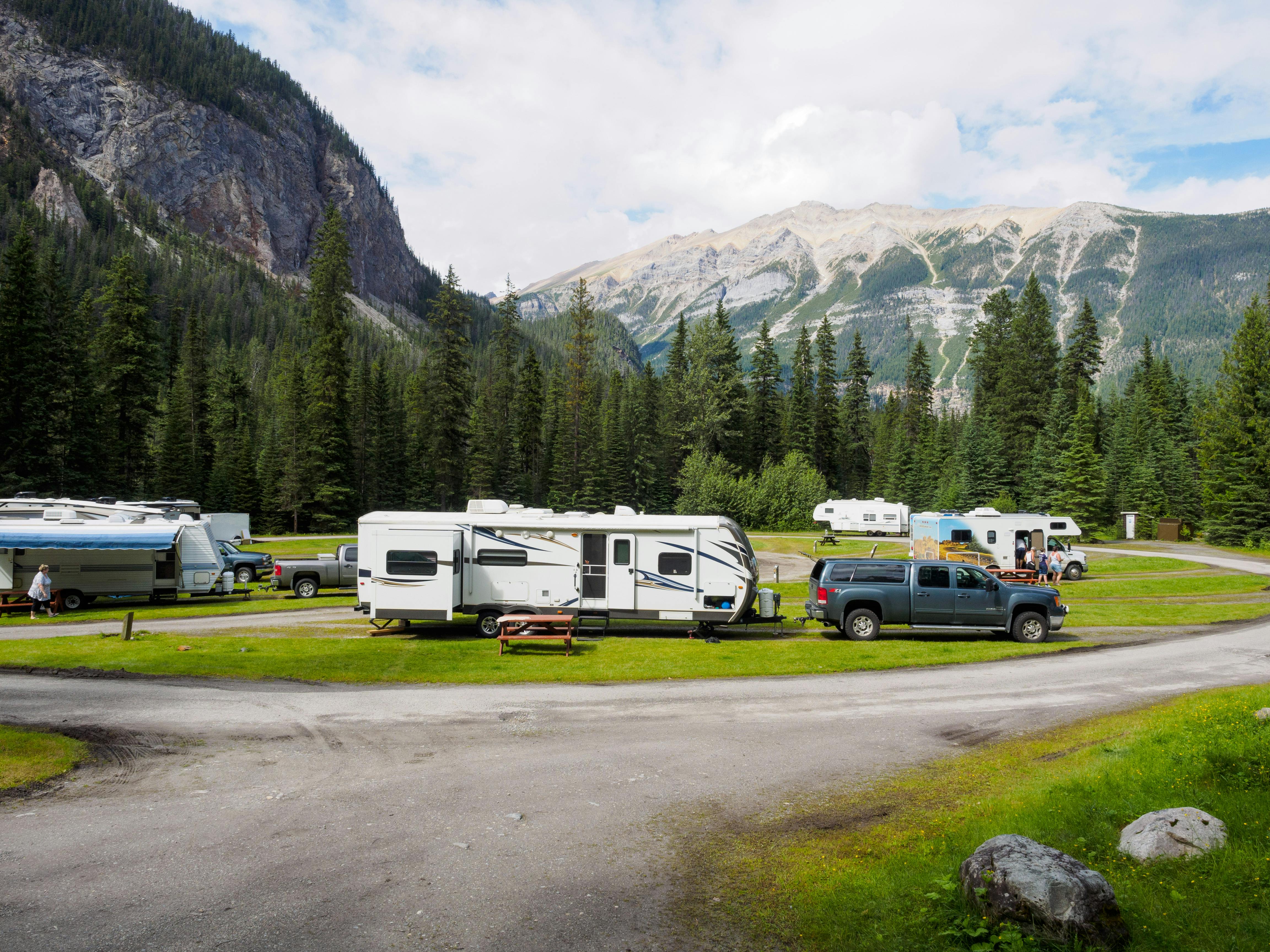 Portable power station powering an RV at a campsite